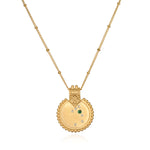 The Mandala Zodiac Taurus Emerald Necklace displayed elegantly, featuring the emerald stone and crafted in 18kt gold plate. This spiritual jewelry captures the essence of Taurus, making it a perfect meditation gift and a meaningful amulet for manifestation with protective and sacred qualities.
