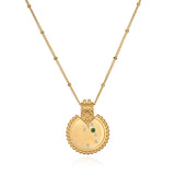 The Mandala Zodiac Taurus Emerald Necklace displayed elegantly, featuring the emerald stone and crafted in 18kt gold plate. This spiritual jewelry captures the essence of Taurus, making it a perfect meditation gift and a meaningful amulet for manifestation with protective and sacred qualities.
