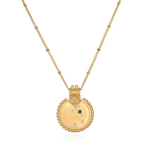 The Mandala Zodiac Taurus Emerald Necklace displayed elegantly, featuring the emerald stone and crafted in 18kt gold plate. This spiritual jewelry captures the essence of Taurus, making it a perfect meditation gift and a meaningful amulet for manifestation with protective and sacred qualities.