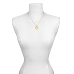 Mandala Zodiac Leo Peridot Necklace displayed on a mannequin, showcasing its design and connection to spiritual practices, yoga, and manifestation features related to the fire sign Leo.