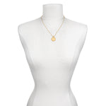 The Mandala Zodiac Aries White Topaz Necklace displayed on a form, highlighting its elegant design and significance as a spiritual amulet. This sacred piece combines beauty and meaning, making it an ideal gift for those in search of manifestation tools and zodiac-inspired jewelry.