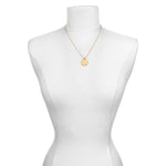 The Mandala Zodiac Scorpio Citrine Necklace displayed elegantly on a mannequin, emphasizing its beauty as spiritual jewelry. This talisman represents the zodiac's energy, ideal for meditation, fostering a meaningful connection to the sun, moon, and personal manifestation.