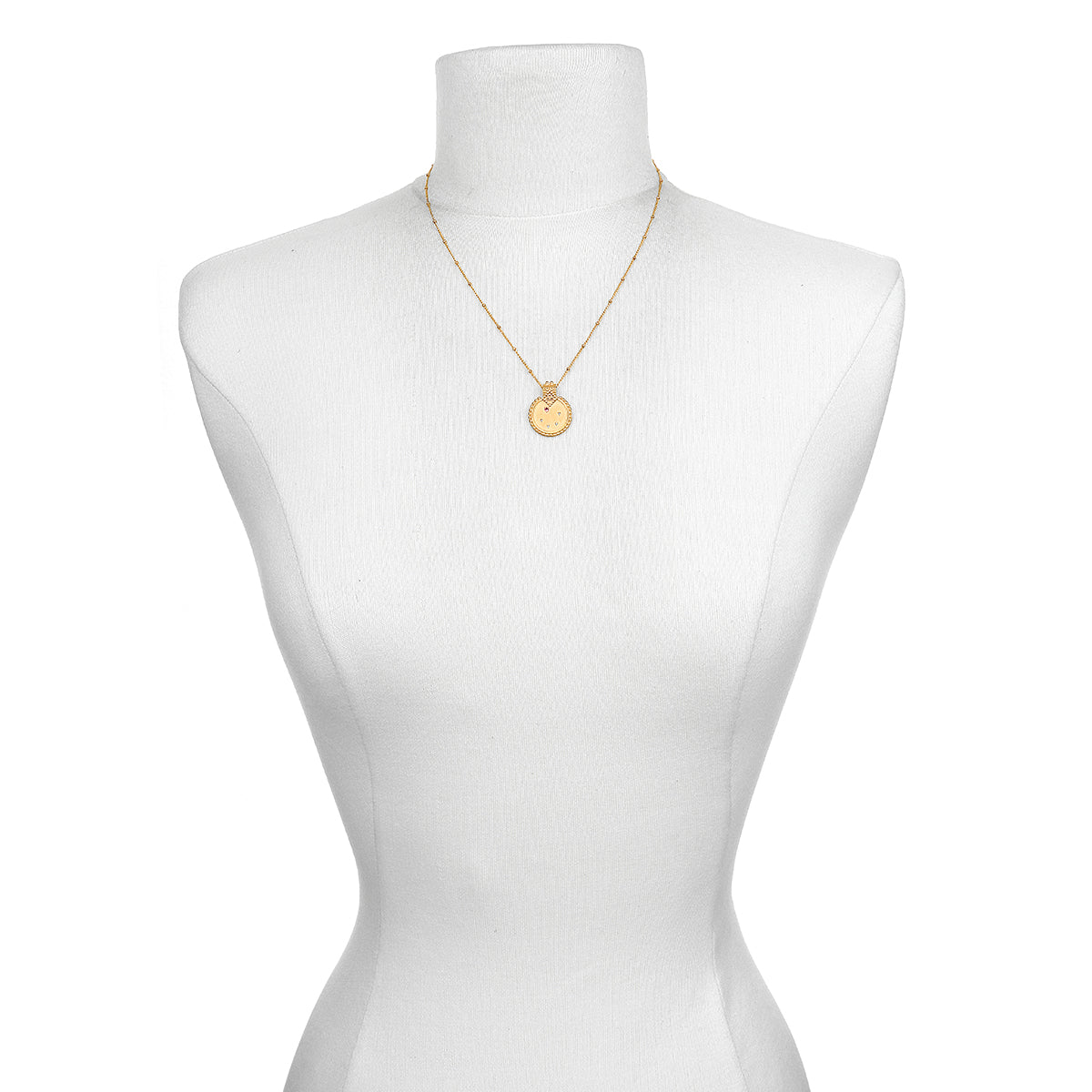 Mandala Zodiac Libra Pink Tourmaline Necklace showcased on a mannequin, representing a beautiful piece of spiritual jewelry that holds significance for yoga and meditation lovers.