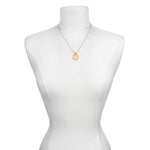 Mandala Zodiac Libra Pink Tourmaline Necklace showcased on a mannequin, representing a beautiful piece of spiritual jewelry that holds significance for yoga and meditation lovers.