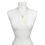 Mandala Zodiac Libra Pink Tourmaline Necklace showcased on a mannequin, representing a beautiful piece of spiritual jewelry that holds significance for yoga and meditation lovers.