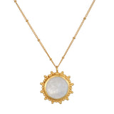 Drift Into Daydreams Moonstone Gemstone Necklace featuring a stunning moonstone pendant surrounded by an intricate beaded starburst design in 18kt gold plate, embodying spiritual jewelry and meaning for meditation and manifestation.