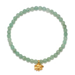 Inspired Spirit Bracelet featuring green aventurine beads and a gold lotus pendant. This beautiful piece of spiritual jewelry promotes balance and creativity, making it perfect for meditation and manifestation. Ideal for yoga enthusiasts and those seeking meaningful protection talismans.