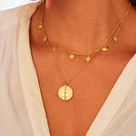 A close-up of the Aligned in Harmony Chakra Choker layered with another elegant necklace, beautifully highlighting its gold plates and chakra engravings. This spiritual jewelry piece is ideal for those seeking protection, energy balance, and inspiration in their meditation and yoga practices.