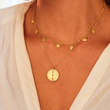 A close-up of the Aligned in Harmony Chakra Choker layered with another elegant necklace, beautifully highlighting its gold plates and chakra engravings. This spiritual jewelry piece is ideal for those seeking protection, energy balance, and inspiration in their meditation and yoga practices.