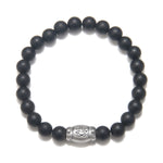 Men's Ganesha Hindu God Black Onyx Bracelet featuring matte black onyx beads and a sterling silver barrel bead accent, perfect for spiritual jewelry, meditation gifts, and meaningful mantras. This bracelet symbolizes protection and grounding energy, making it a significant amulet for yoga and manifestation practices.
