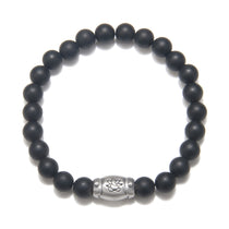 Men's Ganesha Hindu God Black Onyx Bracelet featuring matte black onyx beads and a sterling silver barrel bead accent, perfect for spiritual jewelry, meditation gifts, and meaningful mantras. This bracelet symbolizes protection and grounding energy, making it a significant amulet for yoga and manifestation practices.