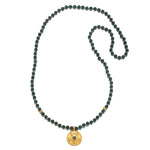 All Paths Malachite Mala Necklace featuring 108 malachite beads and a stunning golden pendant with sacred symbols, perfect for spiritual jewelry and meditation, representing meaningful protection and charm for yoga and manifestation.
