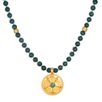 All Paths Malachite Mala Necklace featuring smooth malachite beads and a golden pendant with sacred symbols. This spiritual jewelry is ideal for meditation, serving as a talisman for protection and meaningful manifestation. Perfect for yoga enthusiasts, it embodies the essence of spiritual values and zodiac harmony.