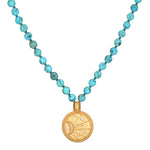 Beyond the Horizon Turquoise Mala featuring 108 turquoise beads and an 18kt gold plated medallion, ideal for meditation and manifestation. This spiritual jewelry acts as a meaningful talisman for charm and protection, symbolizing the sun, moon, and zodiac elements, perfect for yoga and self-expression.