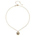 Celestial Birthstone Necklace - January displayed on a white background, featuring a gold chain and an intricately designed pendant with sun and moon elements, ideal for spiritual jewelry and meditation, symbolizing protection and meaning.