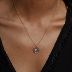 Close-up of the Celestial Birthstone Necklace - October worn by a model, showcasing the meaningful sun and moon pendant. This spiritual jewelry accentuates themes of spiritual connection and reflects the essence of zodiac energies while being ideal for meditation and personal meaning.