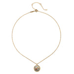 The Celestial Birthstone Necklace - October displayed on a white background, highlighting the detailed 18kt gold plate pendant with a tourmaline accent. This spiritual piece is a beautiful talisman that embodies protections and serves as an inspiration for meditation and yoga.