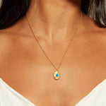 Model wearing the Lotus Turquoise Birthstone Locket Necklace - December, exuding elegance and radiance. This spiritual jewelry piece reflects the essence of yoga and meaningful connections, making it a perfect charm for spiritual growth.