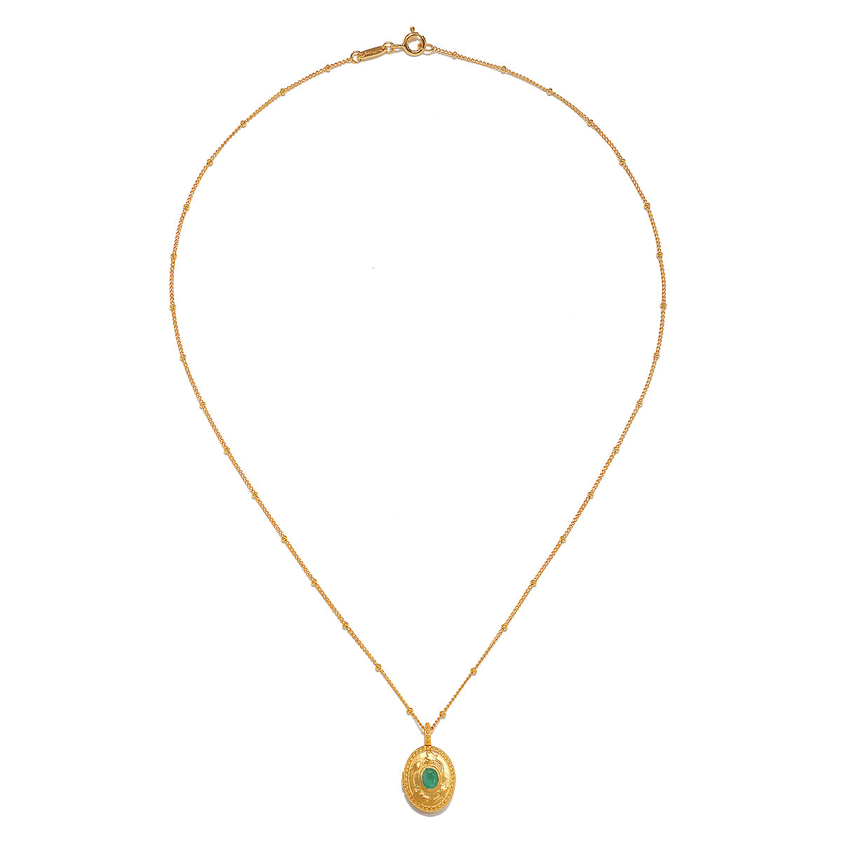The Lotus Emerald Birthstone Locket Necklace - May displayed elegantly, highlighting its intricate design and the emerald stone. This spiritual jewelry piece is perfect for those who connect with their zodiac traits and appreciate the meaning behind meditation and manifestation, while also adding a touch of charm to their ensemble.