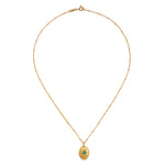 The Lotus Emerald Birthstone Locket Necklace - May displayed elegantly, highlighting its intricate design and the emerald stone. This spiritual jewelry piece is perfect for those who connect with their zodiac traits and appreciate the meaning behind meditation and manifestation, while also adding a touch of charm to their ensemble.