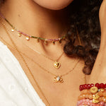 Layered necklaces showcasing the Cultivate Intuition Lotus Moonstone Necklace nestled among other spiritual jewelry pieces. A beautiful example of talismans for protection, meditation, and meaningful expression, enhancing your zodiac-inspired collection and yoga practice.