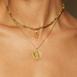 Eternal Energy Snake Coin Necklace displayed alongside a beaded necklace, emphasizing its unique charm and symbolism of immortality. A stylish addition for anyone interested in zodiac and spiritual jewelry that enhances meditation and protection.