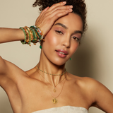 Close-up of a model wearing the Enduring Individuality White Topaz Snake Necklace paired with vibrant bracelets, representing a blend of beauty and spirituality, making it a perfect charm for zodiac enthusiasts and yoga practitioners.