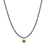 Light Seeker Lapis Starburst Choker Necklace featuring a stunning starburst lapis pendant amidst golden rays, perfect for spiritual jewelry and meditation practices. This elegant piece symbolizes protection and power, embodying the sun's vitality and the essence of meaningful manifestations.