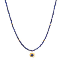 Light Seeker Lapis Starburst Choker Necklace featuring a stunning starburst lapis pendant amidst golden rays, perfect for spiritual jewelry and meditation practices. This elegant piece symbolizes protection and power, embodying the sun's vitality and the essence of meaningful manifestations.