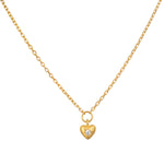 Boundless Love Mini Heart Pendant Necklace on a delicate chain, featuring a hammered 18kt gold plated heart pendant adorned with white topaz, embodying spiritual jewelry with charm and meaning for meditation and manifestation.