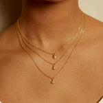 Model wearing the Boundless Love Mini Heart Pendant Necklace layered with other necklaces, showcasing a beautiful display of spiritual jewelry that represents love, protection, and meaningful connections.