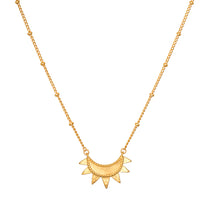 Emergence Gold Sunburst Necklace showcasing an intricate sunburst design, symbolizing vitality and leadership, perfect for spiritual jewelry and meditation, adding meaning and charm to any yoga practice.