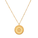 Detailed view of the sun side of the First Light Gold Medallion Reversible Pendant Necklace, representing leadership and life, ideal as a meaningful talisman for meditation and spiritual practices.