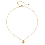 Close-up of the Bloom in Peace Lotus & Tourmaline Necklace, displaying the 18kt gold plate lotus pendant accented by a pink tourmaline gemstone. This piece of spiritual jewelry is perfect for those seeking balance and meaning in their meditation and manifestation practices.