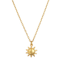 Here Comes the Sun Necklace featuring a hammered 18kt gold plated sun pendant on a delicate chain, embodying the meaning of vitality and leadership. This spiritual jewelry is perfect for meditation and manifestation, resonating with the sun's powerful energy. Ideal for yoga enthusiasts seeking meaningful talismans.