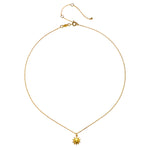Close-up view of the Here Comes the Sun Necklace featuring a hammered gold sun pendant on a delicate chain, highlighting its significance in spiritual jewelry and yoga accessories. This meaningful talisman symbolizes vitality and connection to the universe.