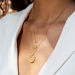Layered view of Buddha, Inner Peace Necklace featuring a Buddha pendant along with an additional charm. This spiritual jewelry duo represents tranquility and mindfulness, great for meditation and yoga. A meaningful talisman that encourages protection and fosters a connection to spirituality.