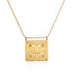 Sacred Commencement Lotus Necklace featuring a gleaming square pendant with an engraved lotus flower symbolizing new beginnings and full potential. This spiritual jewelry piece serves as a talisman for meditation and manifestation, perfect for yoga enthusiasts and those seeking meaningful protection from the universe.