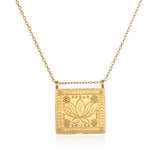 Sacred Commencement Lotus Necklace featuring a gleaming square pendant with an engraved lotus flower symbolizing new beginnings and full potential. This spiritual jewelry piece serves as a talisman for meditation and manifestation, perfect for yoga enthusiasts and those seeking meaningful protection from the universe.