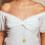 The Gold Mandala Necklace displayed elegantly on a model, emphasizing its design and significance in spiritual jewelry, making it a thoughtful gift for yoga enthusiasts and those seeking spiritual meaning.