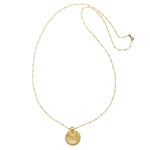 The Gold Mandala Necklace showcased on a plain background, focusing on its intricate design and craftsmanship, representing the essence of zen spirituality and serving as a meaningful piece for meditation and zodiac alignment.