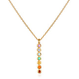 Divine Alignment Gemstone Chakra Necklace featuring vibrant gemstones including amethyst, blue agate, blue topaz, green onyx, citrine, carnelian, and red garnet in a vertical design. This spiritual jewelry piece is perfect for meditation gifts, mantra practice, and yoga. Its meaningful, symbolic nature aids in manifestation while offering protection and connection to sacred energy, making it an ideal amulet for zodiac enthusiasts.