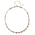 Close-up of the Peace & Protection Tourmaline Choker, highlighting its colorful tourmaline beads and 18k gold charms. This protective jewelry serves as a symbolic amulet for manifestation, connecting to zodiac energies and enhancing spirituality.