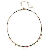 Close-up of the Peace & Protection Tourmaline Choker, highlighting its colorful tourmaline beads and 18k gold charms. This protective jewelry serves as a symbolic amulet for manifestation, connecting to zodiac energies and enhancing spirituality.