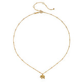 The Stand in Strength Elephant Necklace displayed in a flat lay format, highlighting its delicate gold beaded chain, making it a beautiful choice for protective and sacred spiritual jewelry.