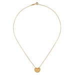 The Mini Mandala Necklace elegantly laid out on a white background, highlighting its 18kt gold plating and intricate design. This piece is perfect for those who appreciate spiritual jewelry, serving as a symbol of manifestation and sacred meaning in their lives.