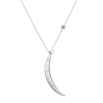Illuminated Path Silver Moon Necklace featuring a hammered crescent moon design, complemented by a turquoise star charm, symbolizing spiritual jewelry, meditation, and protection, perfect for yoga and meaningful manifestation.