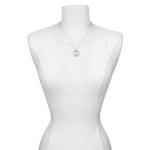 The Divine Alignment Gemstone Chakra Silver Necklace elegantly displayed on a mannequin, illustrating its symbolic meaning and connection to the zodiac, making it an ideal choice for meaningful gifts in the realm of spirituality and yoga.