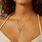 A model wearing the Goddess Moon Charm on a delicate necklace, showcasing the charm's beauty and meaning in spiritual jewelry, ideal for enhancing your meditation and manifestation rituals.