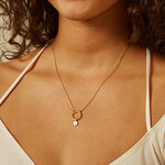 Engraved Lotus Charm featured as spiritual jewelry in a minimalist charm necklace, symbolizing new beginnings and full potential. This meaningful piece is perfect for yoga and meditation enthusiasts, serving as a talisman for manifestation and protection.